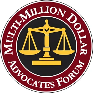 A round logo with a gold justice scale in the center and the words “Multi-Million Dollar Advocates Forum” in white on a red outer ring.